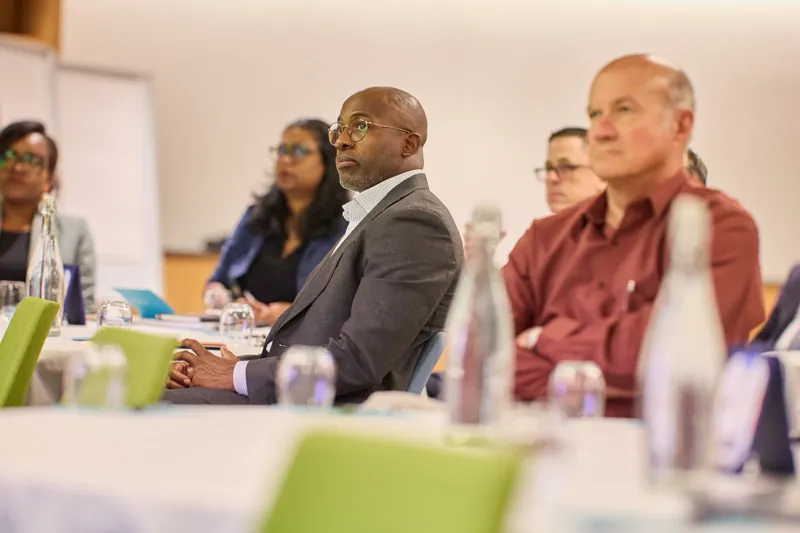 Participants listening during the summit session